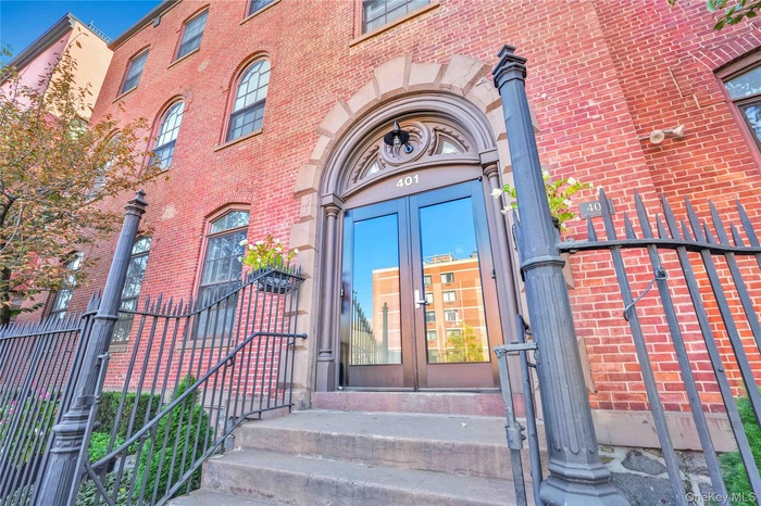 Doorway to property with french doors and brick siding