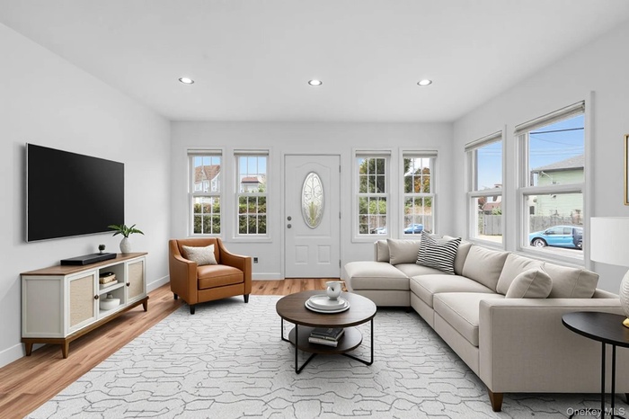 Living area featuring recessed lighting and light wood-style floors
