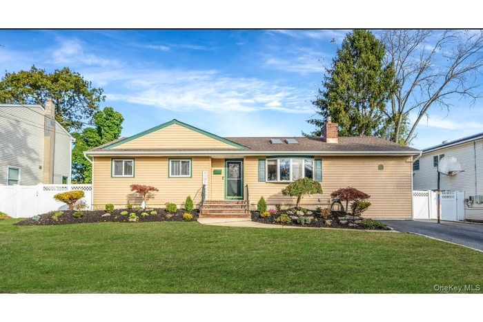 Single story home with a chimney, a gate, roof with shingles, and entry steps