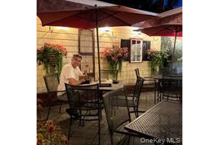 View of patio with outdoor dining area