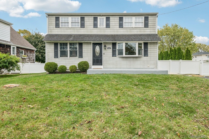 Traditional-style home featuring a shingled roof