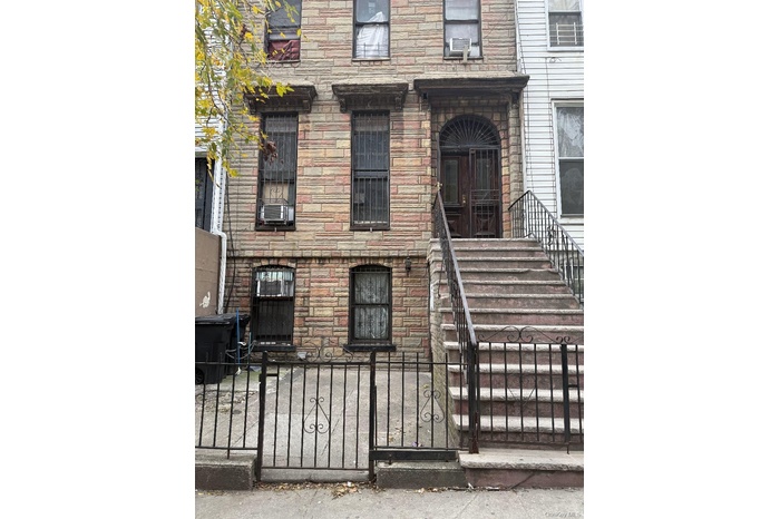 Property entrance with stone siding
