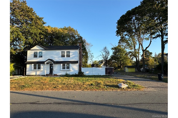 View of front of house with a chimney