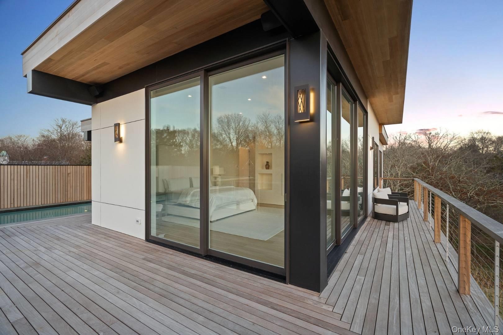 Deck at dusk with a swimming pool