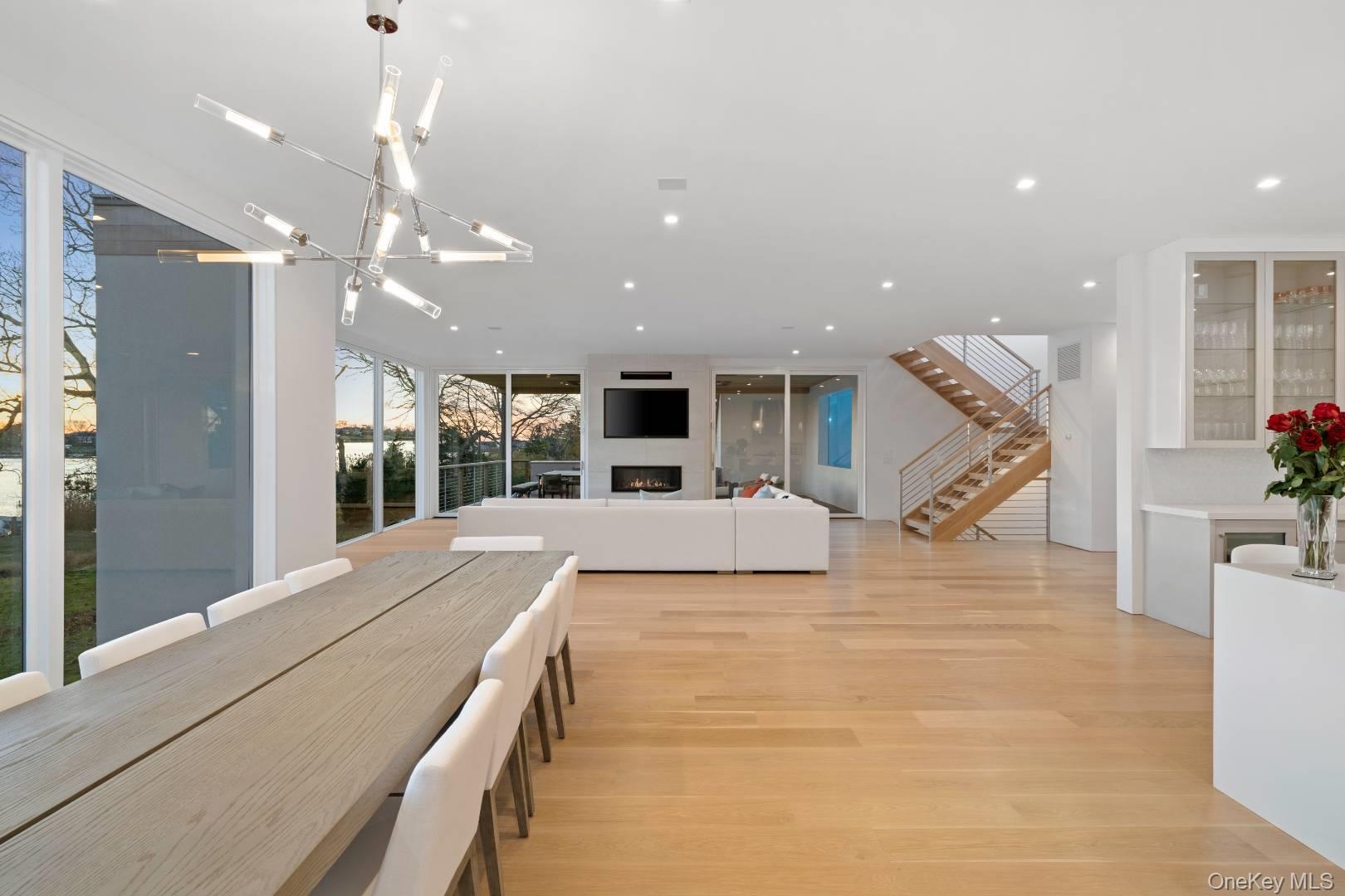 Dining area featuring light hardwood / wood-style floors and an inviting chandelier