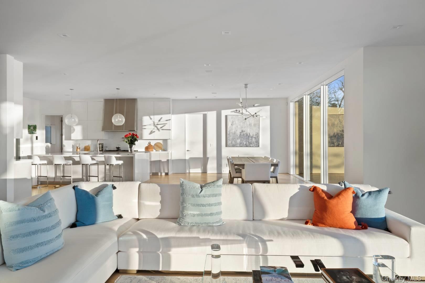 Living room with light hardwood / wood-style floors and an inviting chandelier