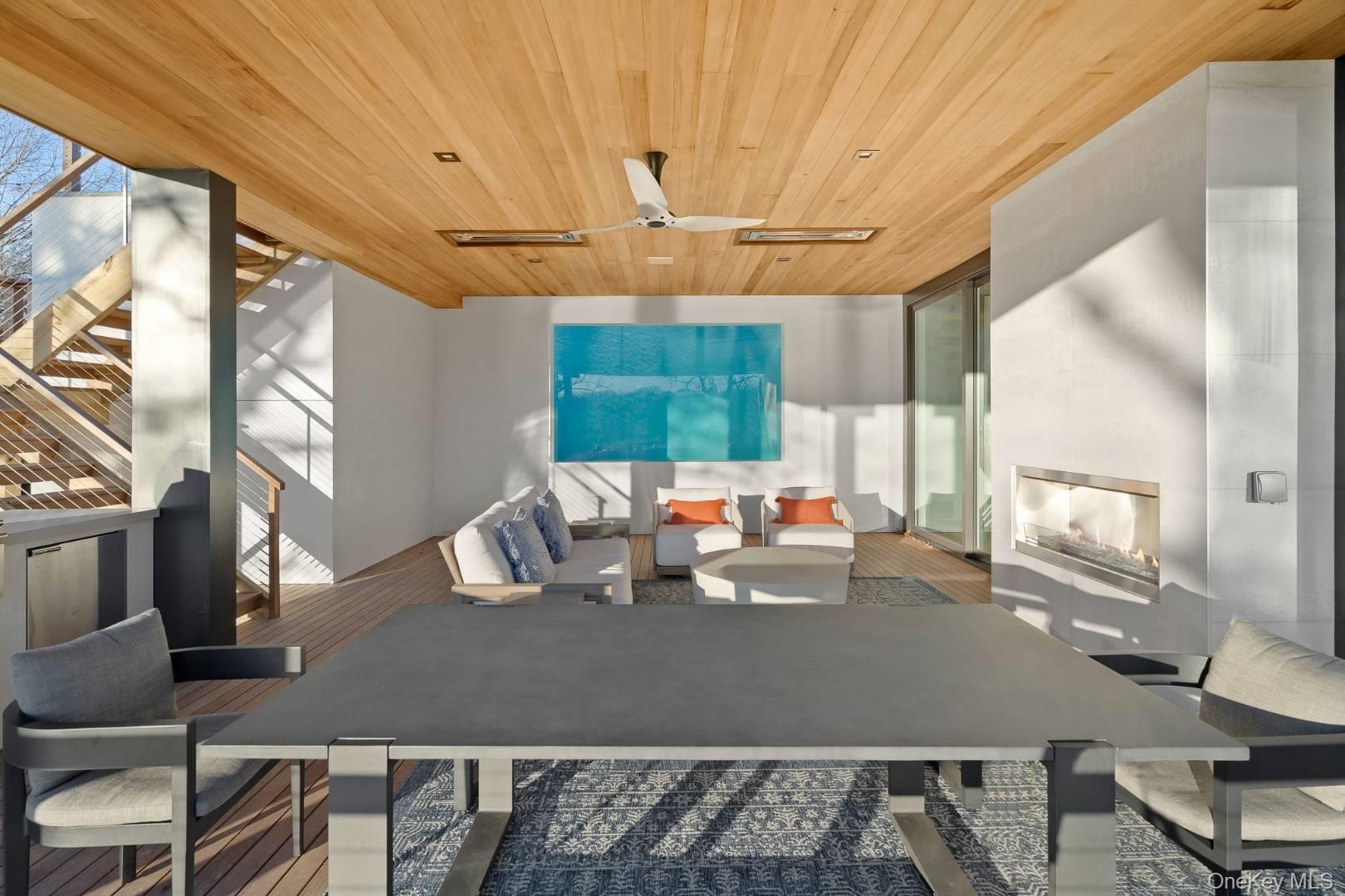 Office featuring floor to ceiling windows, ceiling fan, and wood ceiling