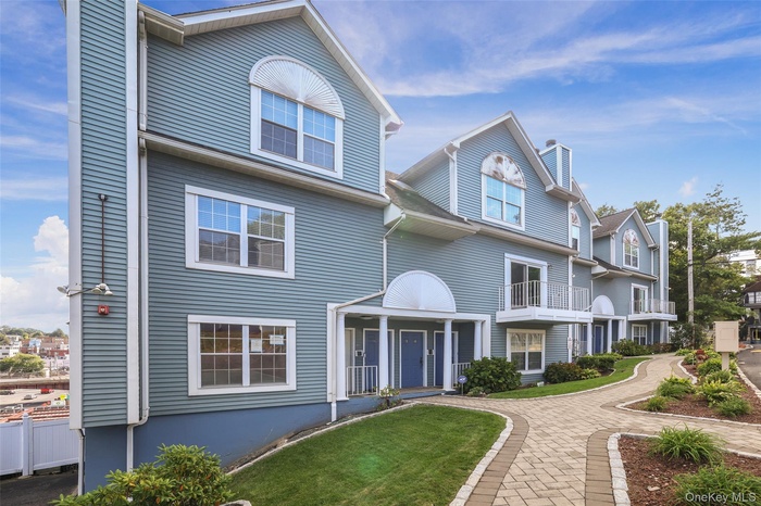 View of front of property featuring a chimney