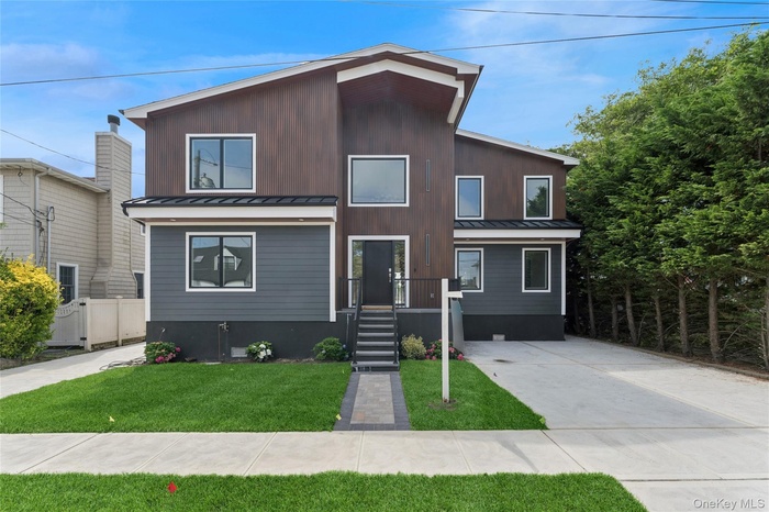 Modern home with a standing seam roof and a metal roof