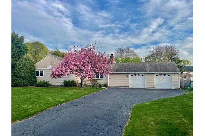 View of front of property with a front lawn