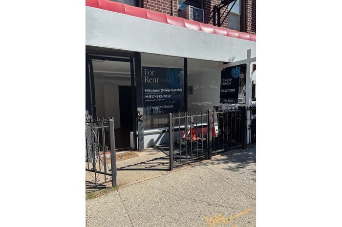 Property entrance featuring brick siding