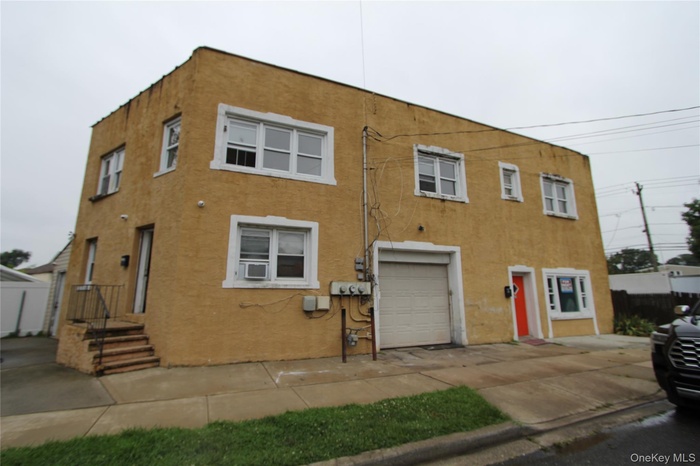 View of front facade with stucco siding