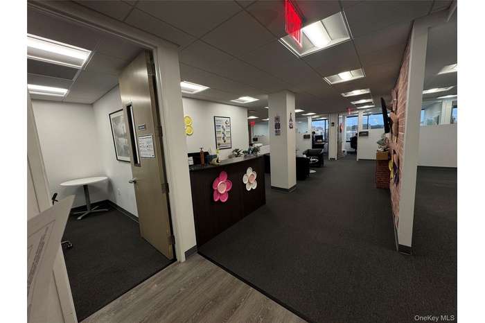 Reception featuring a drop ceiling