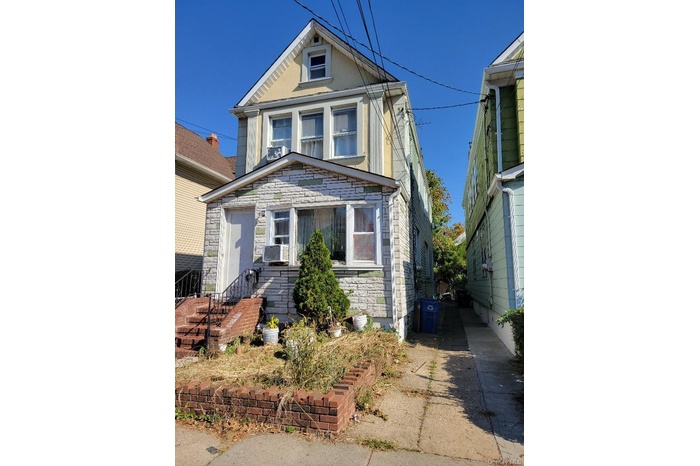 View of front of property featuring stone siding