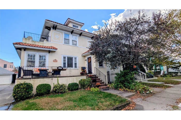 Mediterranean / spanish-style home featuring a tiled roof and stucco siding