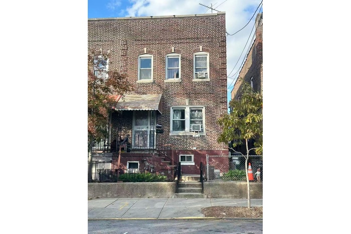 View of front of property featuring brick siding