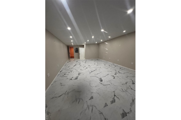 Unfurnished room featuring recessed lighting