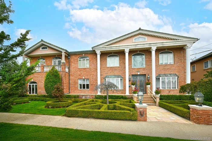 Neoclassical / greek revival house with brick siding