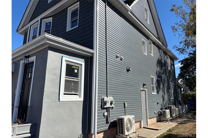 View of home's exterior with an ac unit and stucco siding
