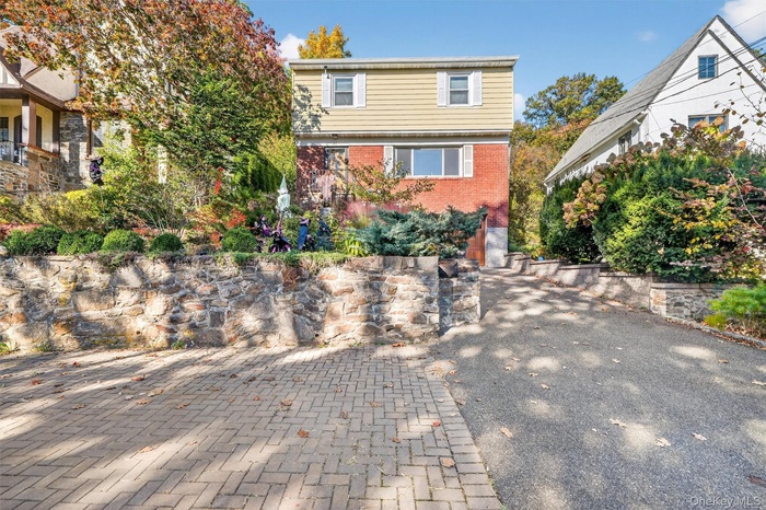 View of front facade featuring brick siding