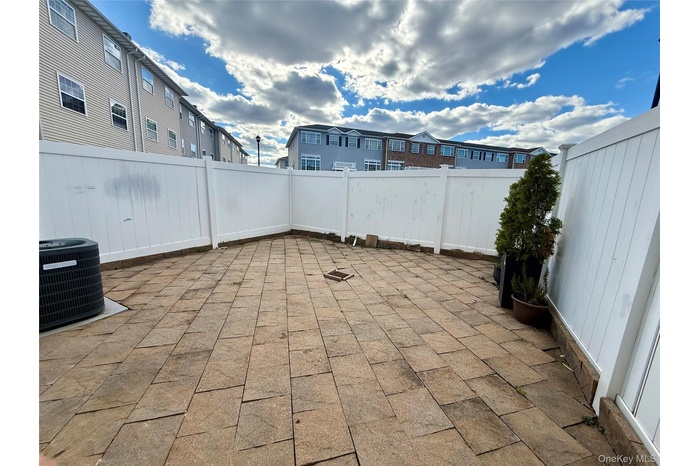 Fenced backyard featuring a patio