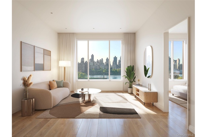 Living room featuring light wood-type flooring and a view of skyline