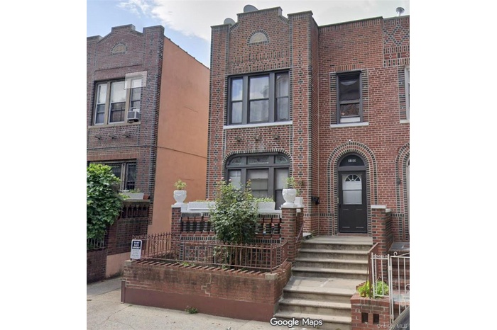 View of front facade featuring brick siding