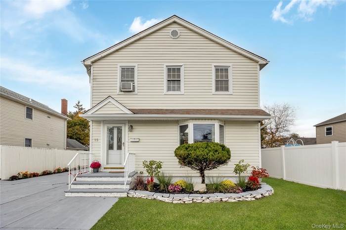 Traditional home with a shingled roof