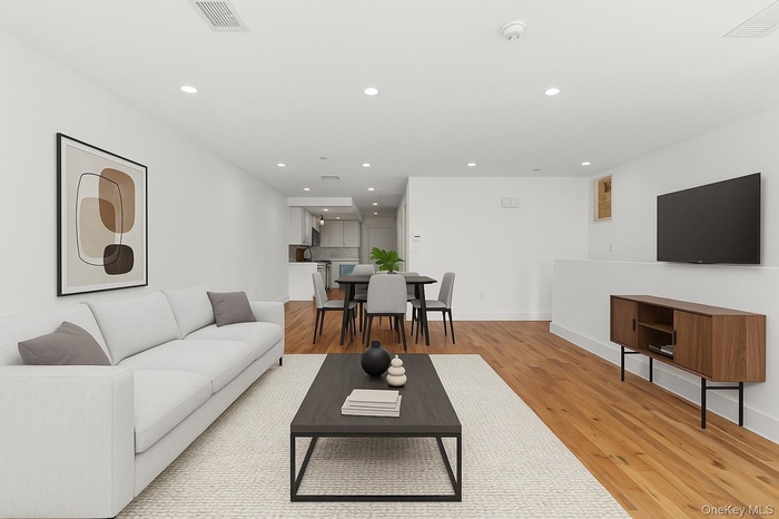 Living area featuring recessed lighting and light wood-style floors