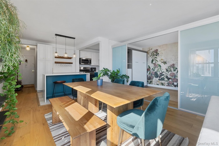 Dining space with light wood finished floors