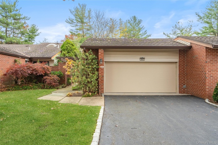 Garage with asphalt driveway