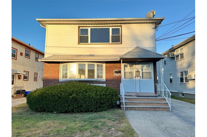 View of front of property with brick siding
