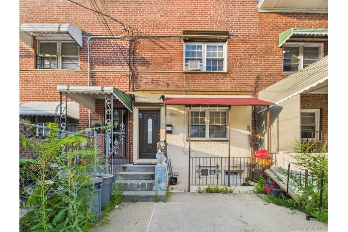 View of front of house featuring brick siding