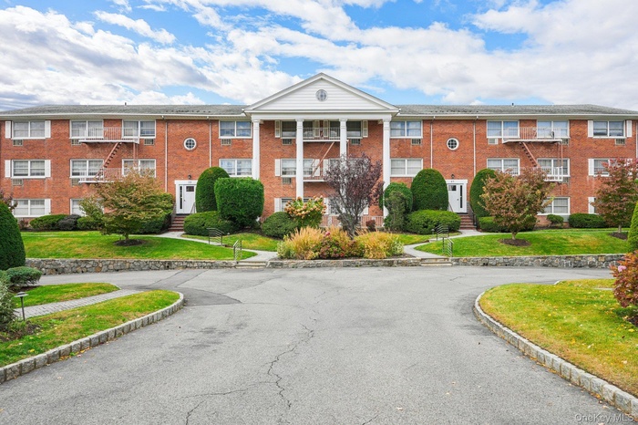 View of building exterior and entrance to complex.