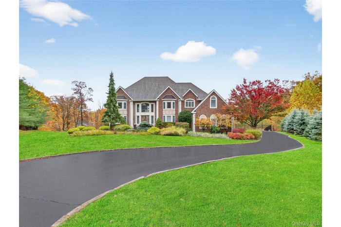 View of front of property with a front lawn