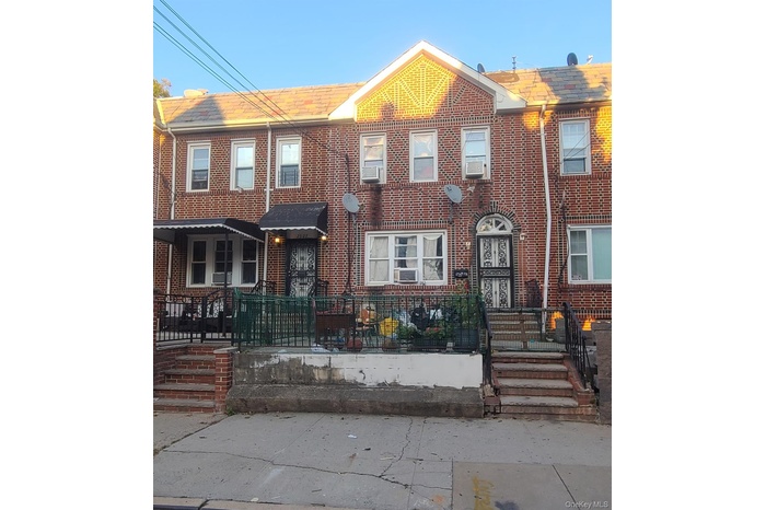 Traditional-style home featuring brick siding