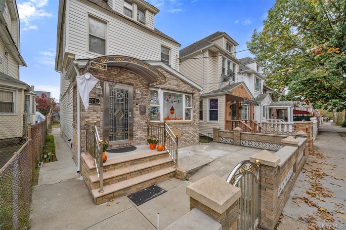 View of front of property featuring brick siding