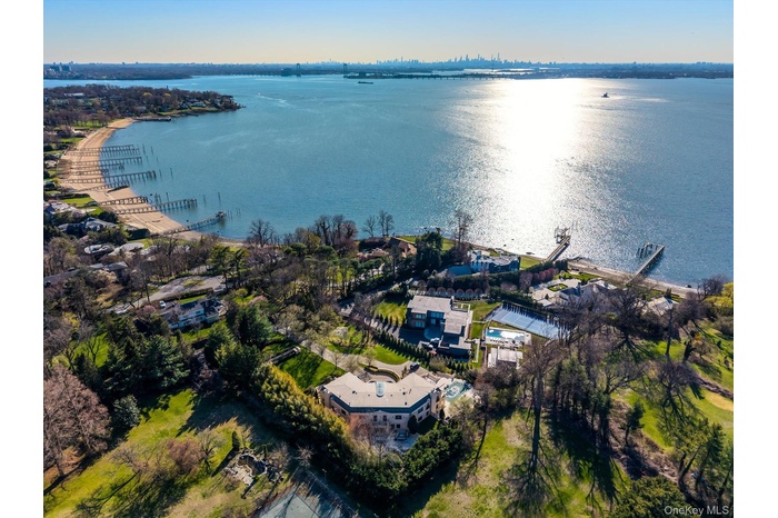 Aerial overview of property's location featuring a large body of water