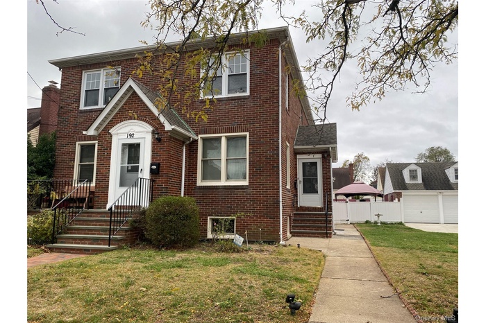 View of front of house featuring brick siding and entry steps