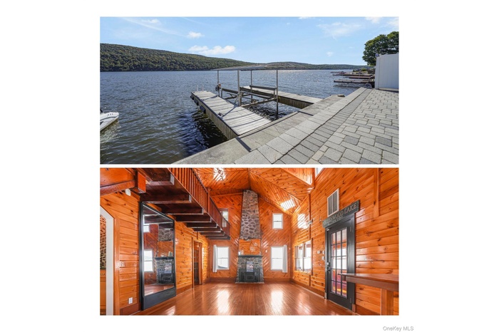 Unfurnished living room featuring wood walls, hardwood / wood-style flooring, a water view, and high vaulted ceiling