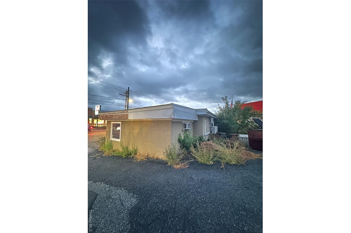 View of home's exterior featuring concrete block siding