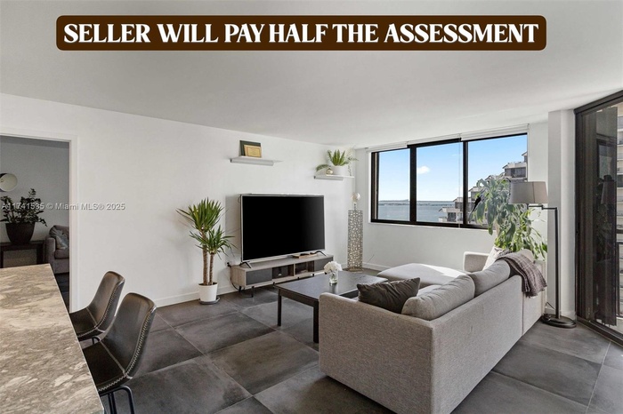 The spacious living area seamlessly connects to a stylish kitchen with high-end finishes, making it perfect for entertaining. Relax while enjoying the