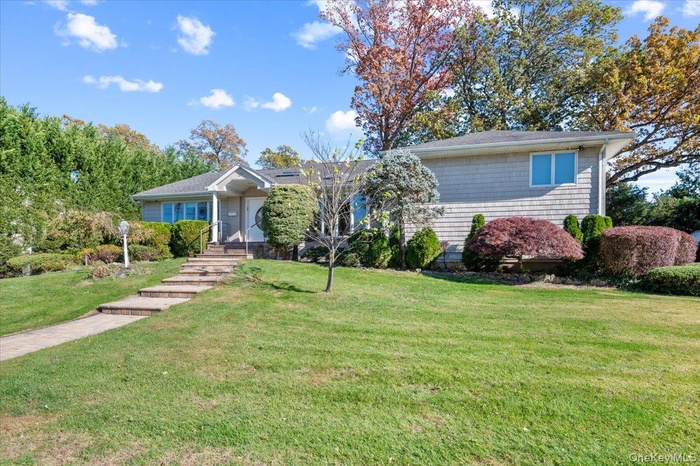 Single story home with a front yard