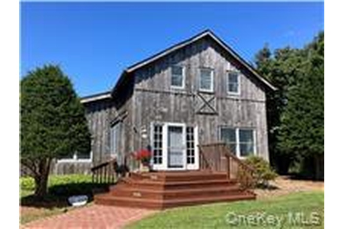 View of front of property with a front yard