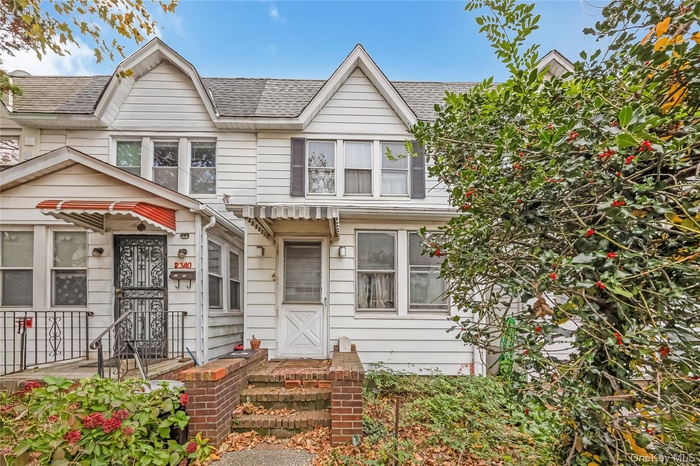 View of front of property featuring a shingled roof