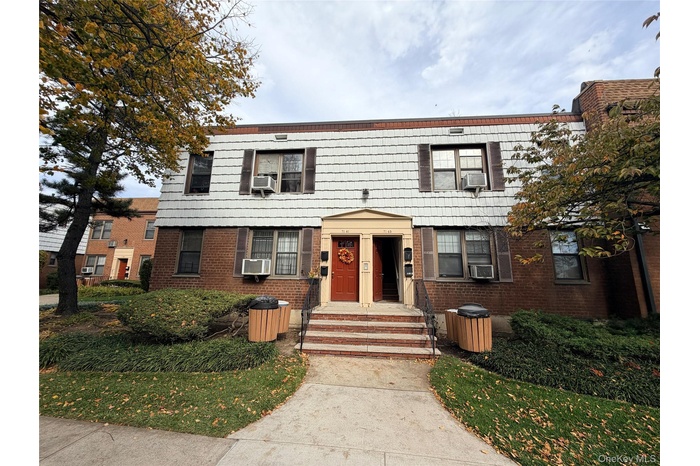 Colonial house with brick siding