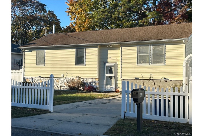 View of front of property with a shingled roof