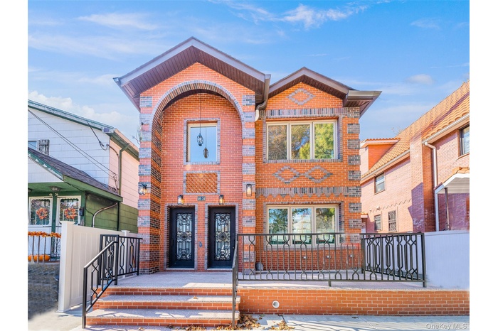 View of front of house featuring brick siding
