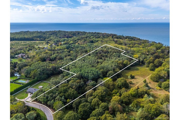 View of property location with property boundaries highlighted and a nearby body of water
