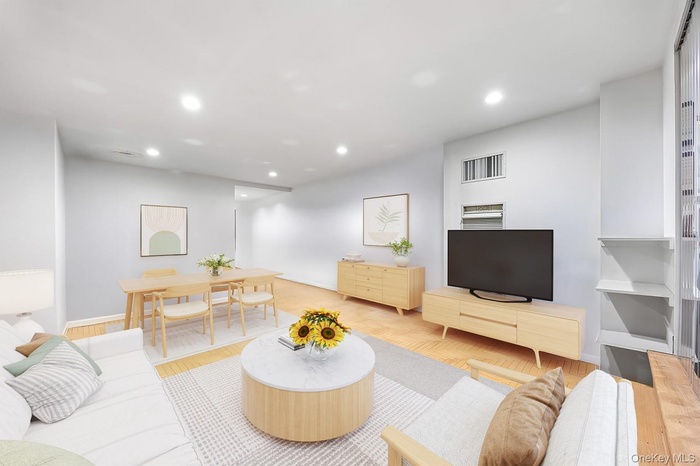 Living area featuring recessed lighting and wood finished floors